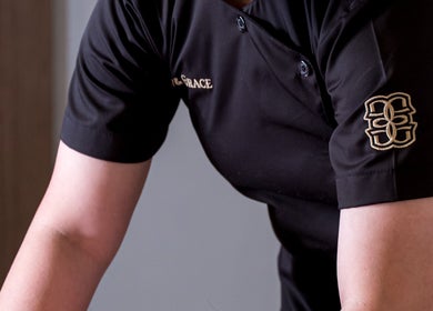 Glow & Grace - Home Service massage session in Riyadh, SA, featuring a therapist in a professional uniform.