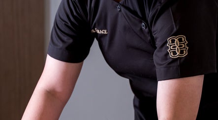 Glow & Grace - Home Service massage session in Riyadh, SA, featuring a therapist in a professional uniform.