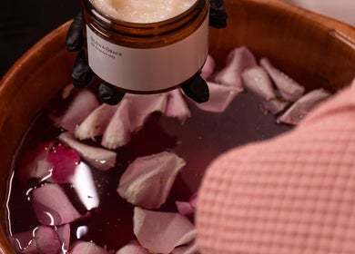 Luxurious spa bowl with rose petals at Glow & Grace - Home Service in Riyadh, SA.