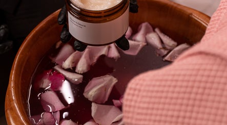 Luxurious rose petal soak with Glow & Grace - Home Service in Riyadh, SA for a serene spa experience.