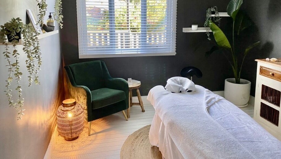 Tranquil massage room at Elements Bodyworks, Doubleview, Western Australia, AU, featuring a plush chair and decor.