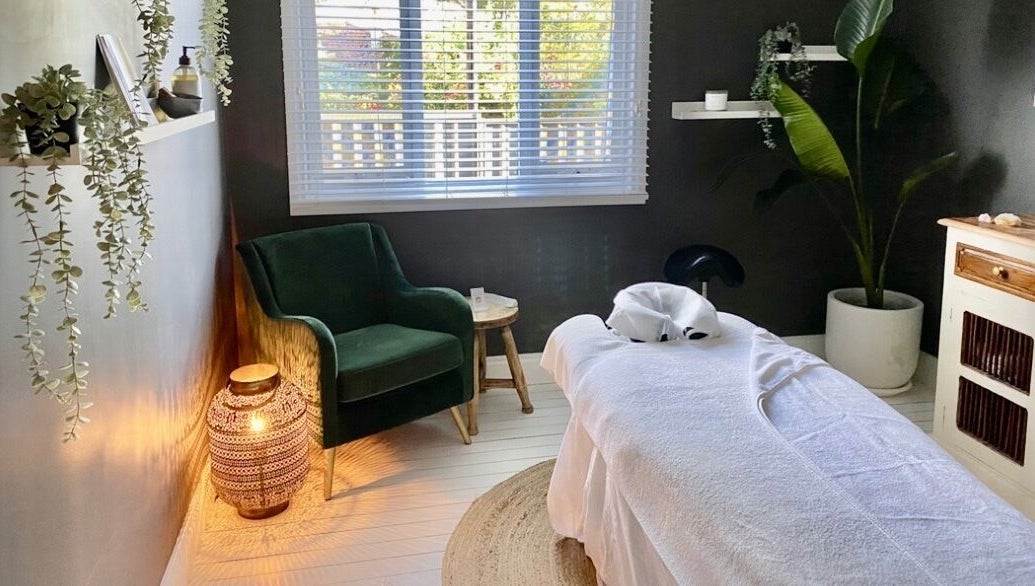 Tranquil massage room at Elements Bodyworks, Doubleview, Western Australia, AU, featuring a plush chair and decor.