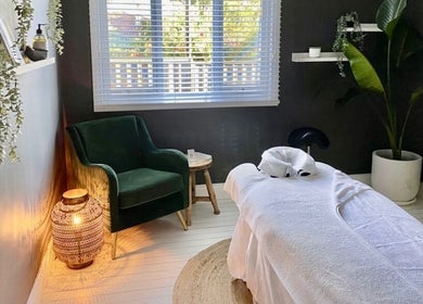 Tranquil massage room at Elements Bodyworks, Doubleview, Western Australia, AU, featuring a plush chair and decor.