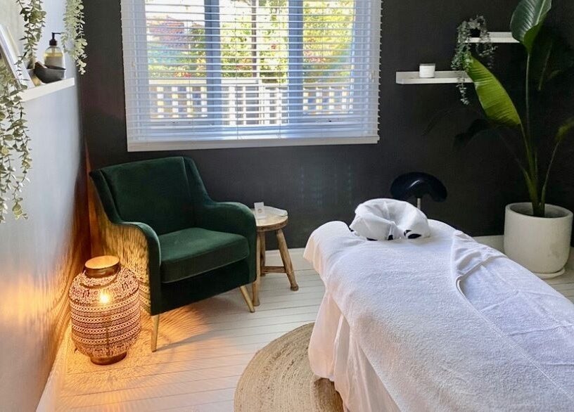 Tranquil massage room at Elements Bodyworks, Doubleview, Western Australia, AU, featuring a plush chair and decor.