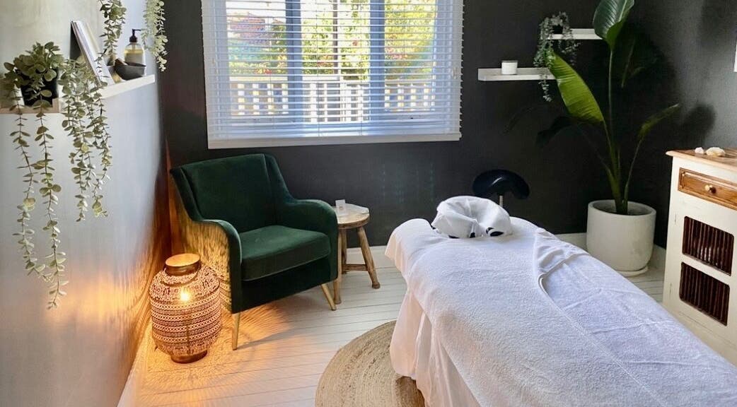 Tranquil massage room at Elements Bodyworks, Doubleview, Western Australia, AU, featuring a plush chair and decor.