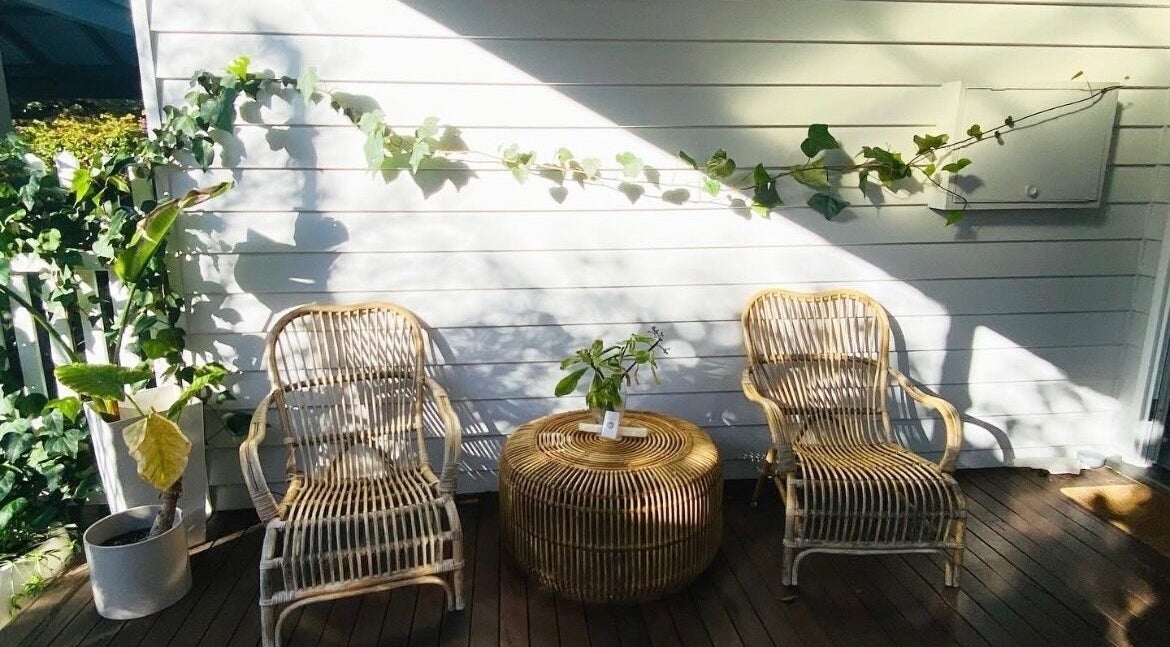 Cozy outdoor seating at Elements Bodyworks in Doubleview, Western Australia, AU under natural sunshine.