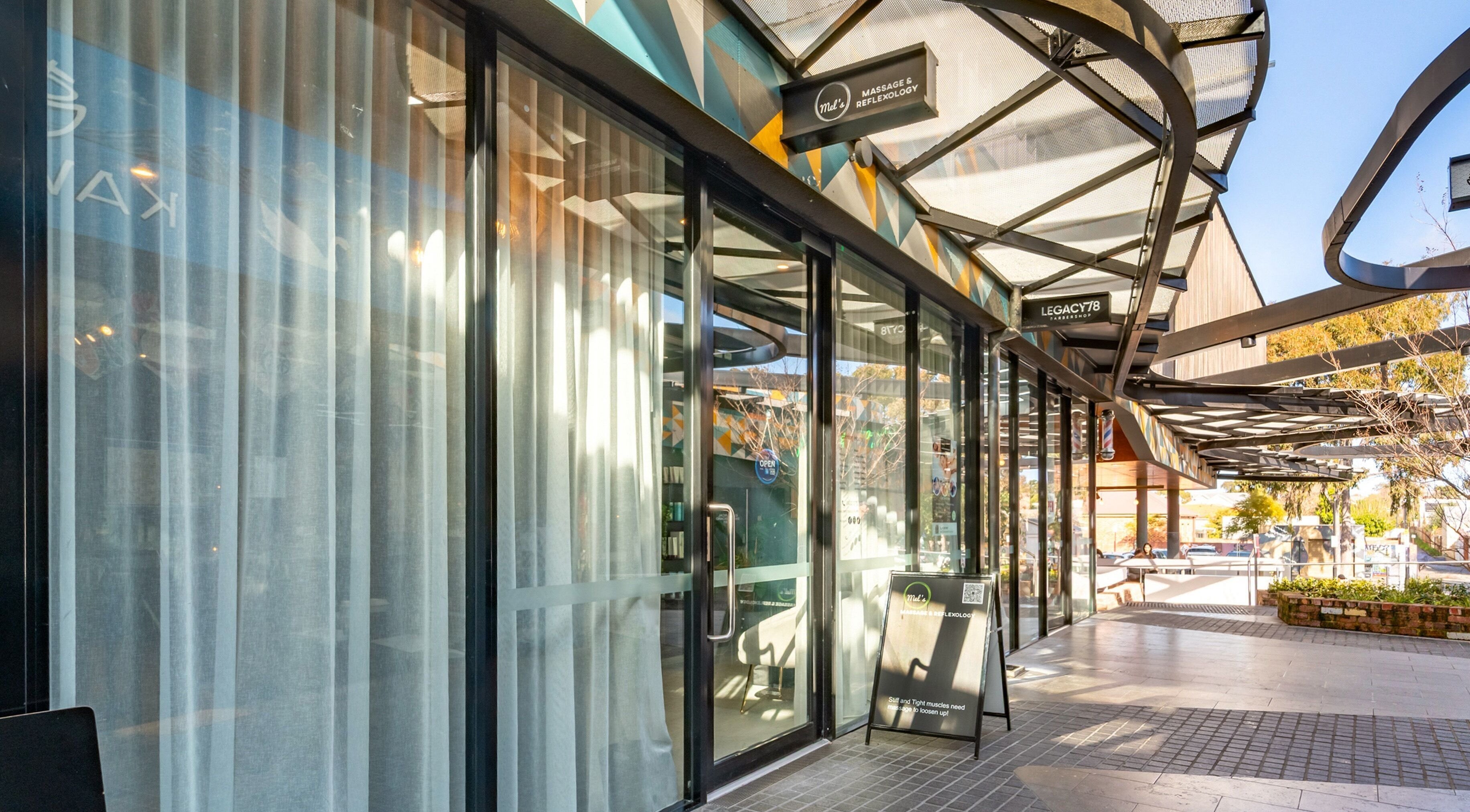 Entrance of Mel's Massage & Reflexology - Mount Lawley, featuring glass doors and outdoor view in Mount Lawley, Western Australia, AU.