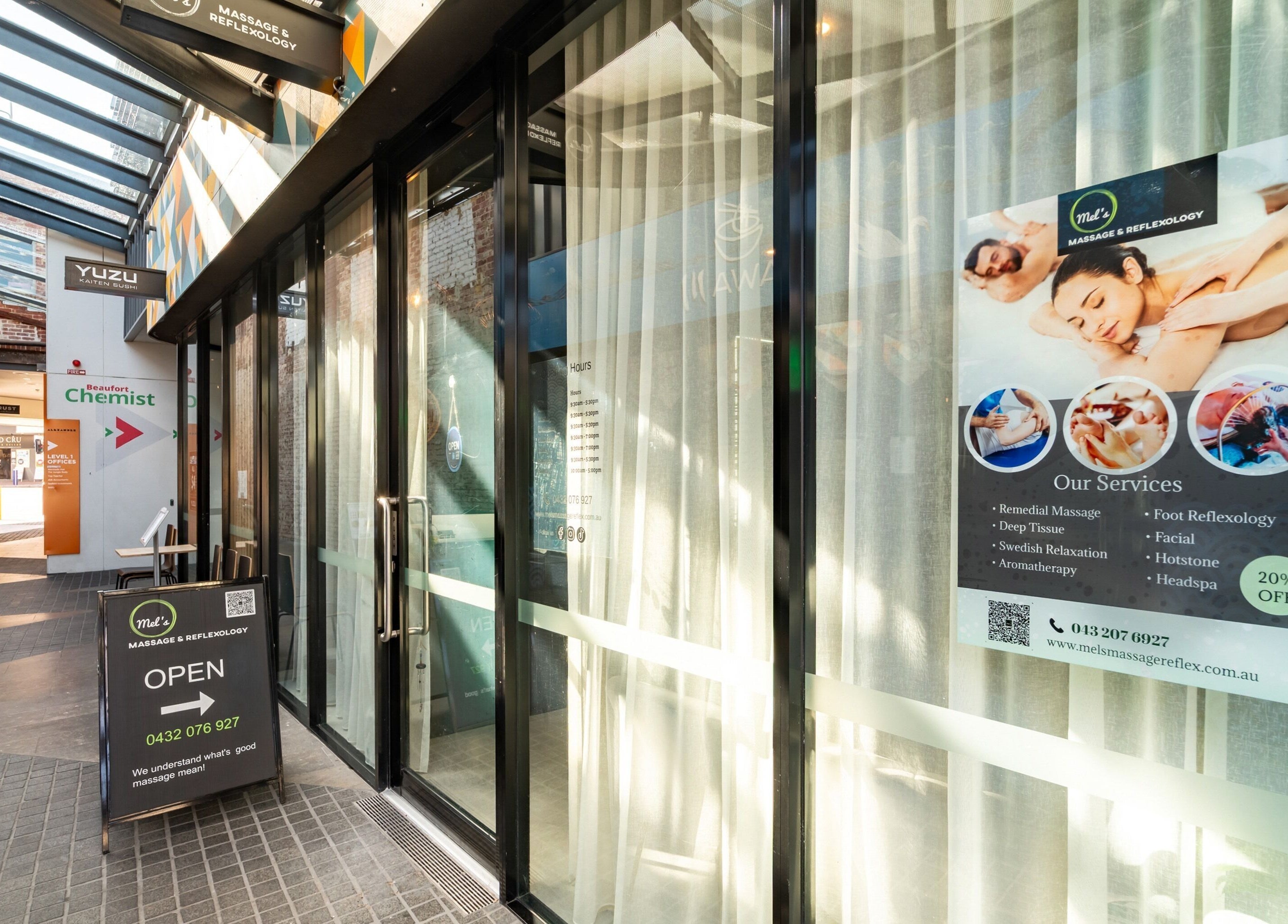 Entrance of Mel's Massage & Reflexology - Mount Lawley, Western Australia, AU showing services poster.