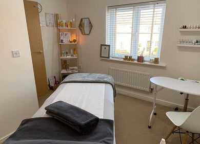 Relaxing treatment room at Sarah Emily Holistics, Helpston, England, GB, with massage table and calming decor.