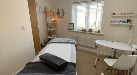 Relaxing treatment room at Sarah Emily Holistics, Helpston, England, GB, with massage table and calming decor.