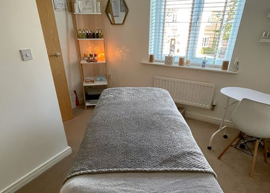 Peaceful treatment room at Sarah Emily Holistics, Helpston, England, GB. Cozy bed and calming decor.