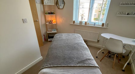 Peaceful treatment room at Sarah Emily Holistics, Helpston, England, GB. Cozy bed and calming decor.