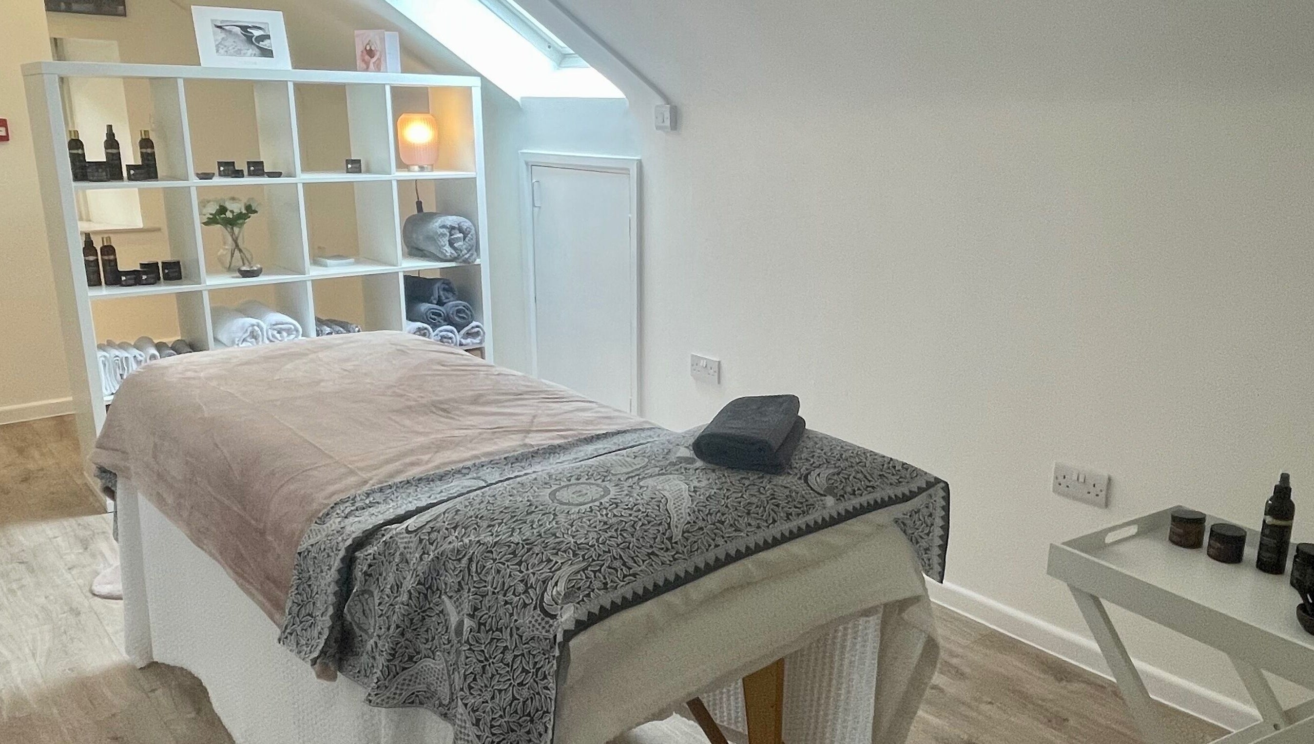 Tranquil massage room at Sarah Emily Holistics, Helpston, England, GB, featuring a cozy setup and soft lighting.