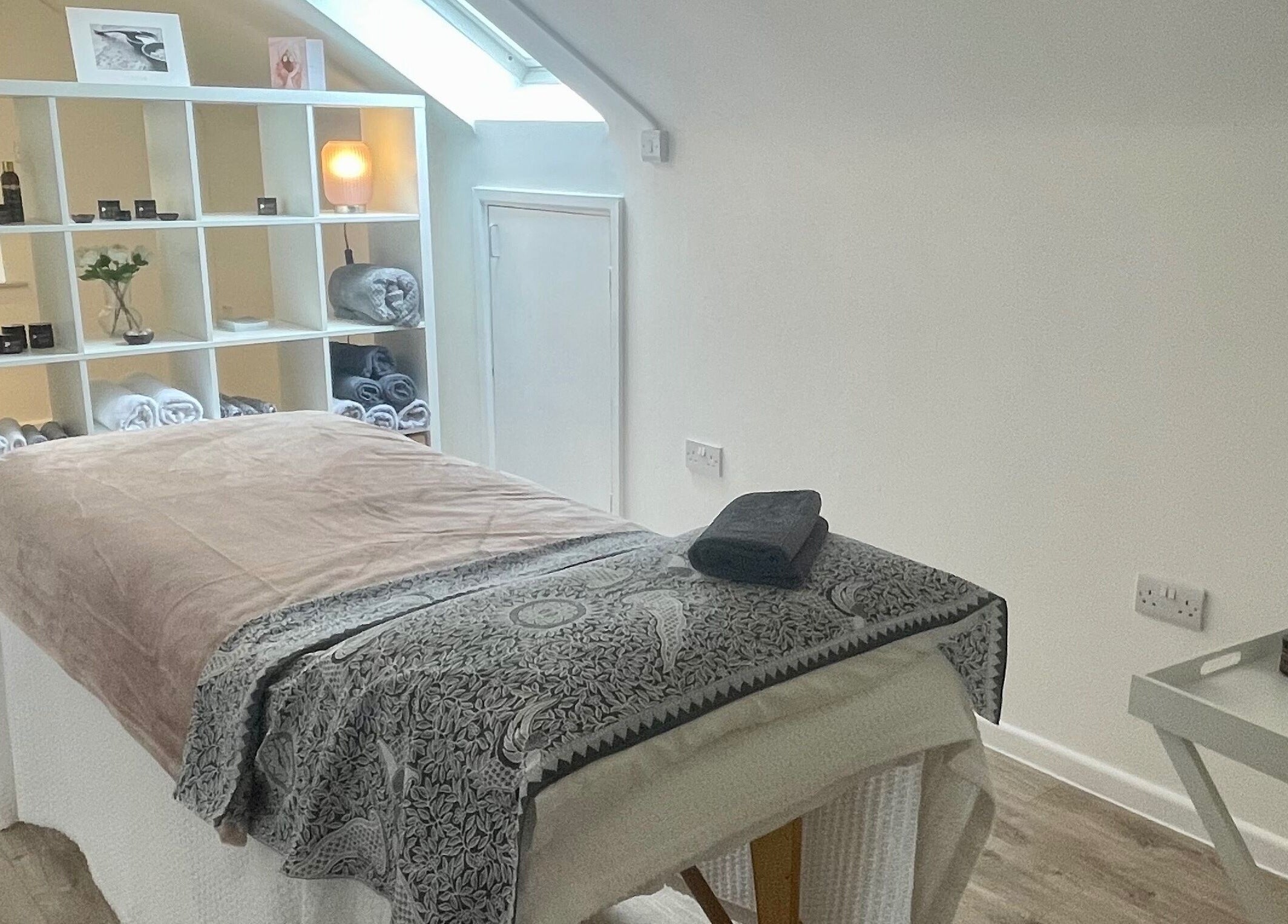 Tranquil massage room at Sarah Emily Holistics, Helpston, England, GB, featuring a cozy setup and soft lighting.