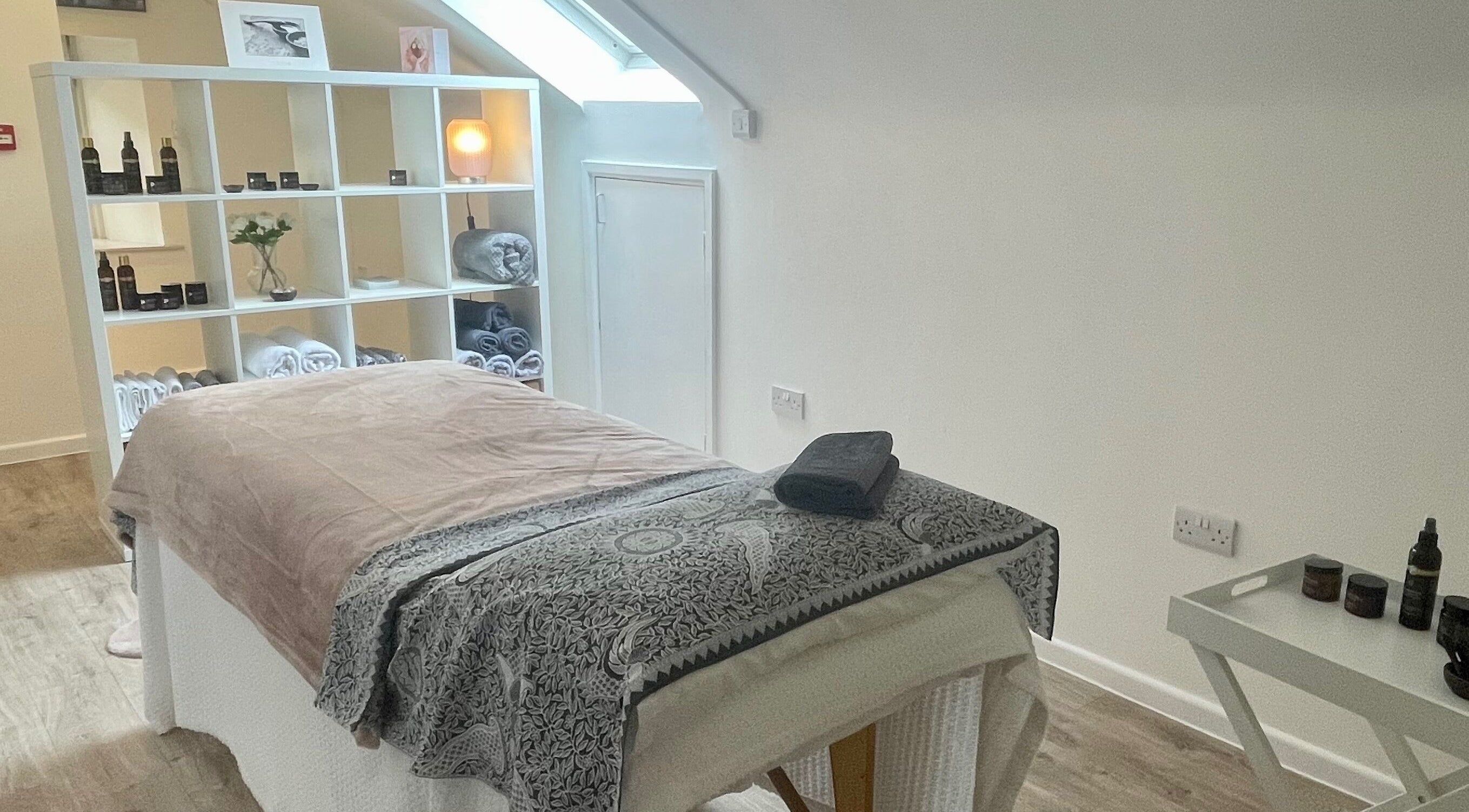 Tranquil massage room at Sarah Emily Holistics, Helpston, England, GB, featuring a cozy setup and soft lighting.