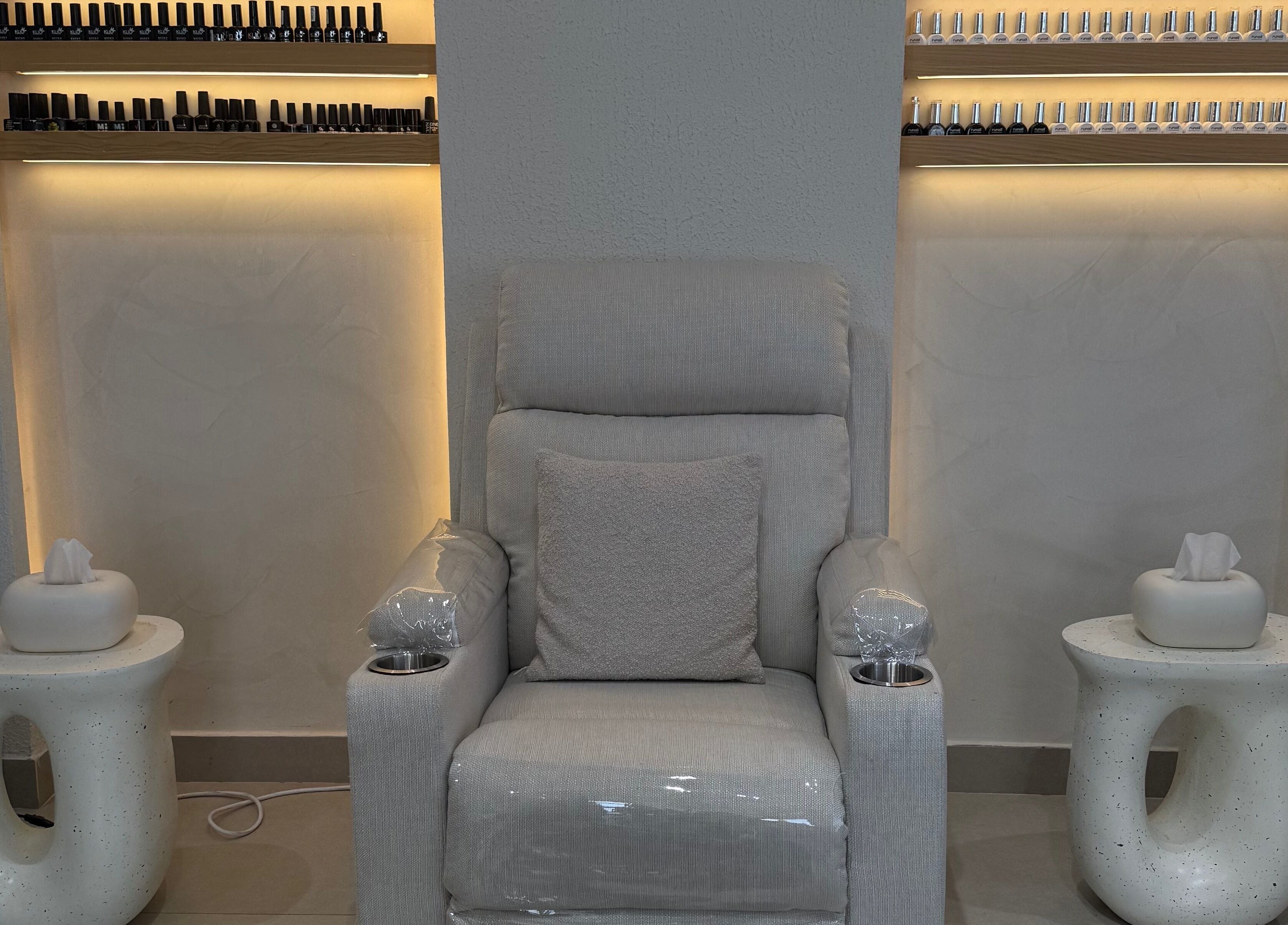 Comfortable nail chair setup at Xtend Beauty Studio, Dubai, AE, offering a relaxing experience.