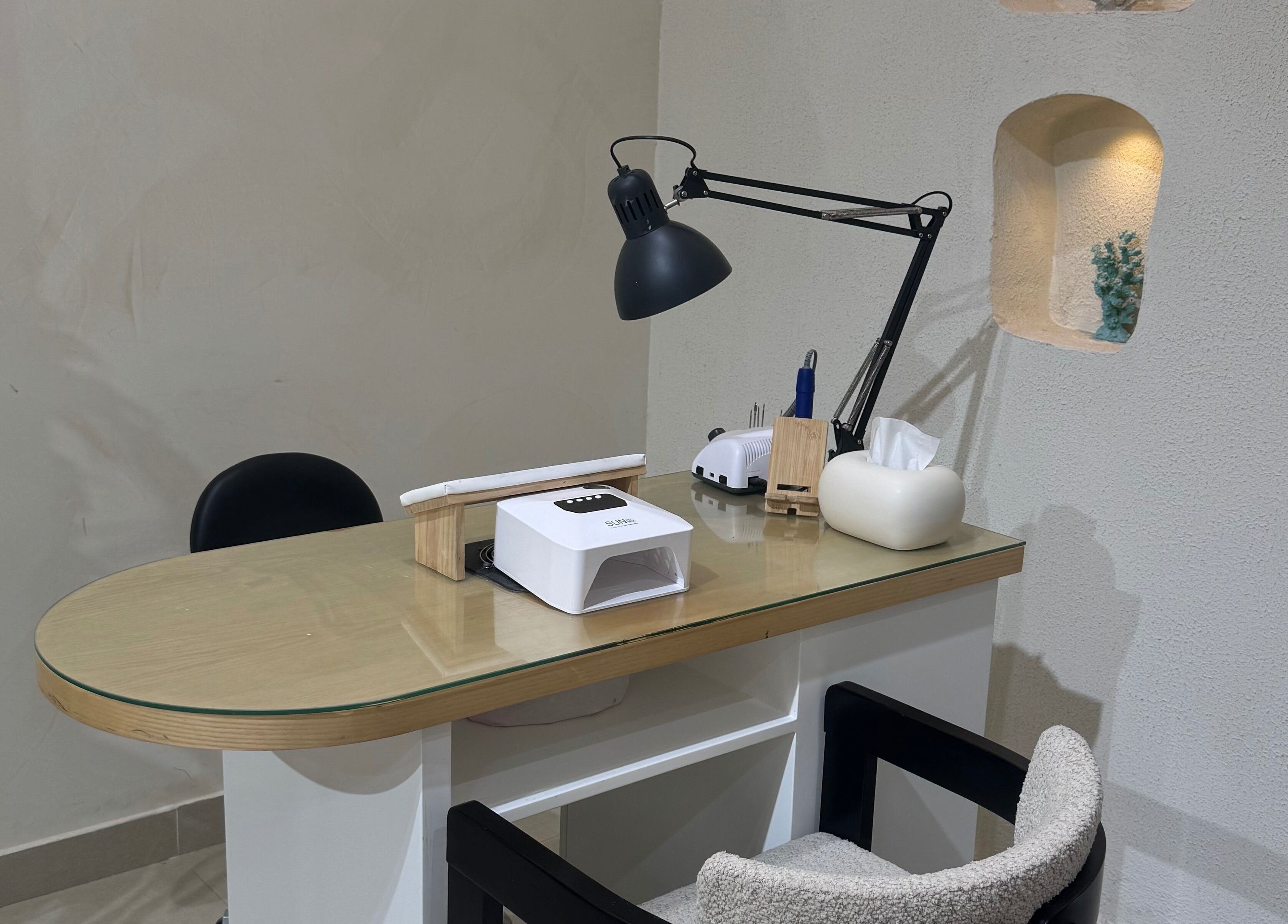 Manicure station at Xtend Beauty Studio in Dubai, AE, featuring sleek and modern design.