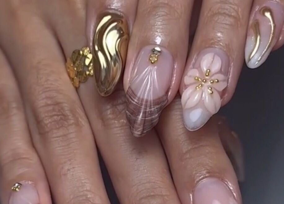Elegantly designed floral and metallic nails at Xtend Beauty Studio, Dubai, AE.