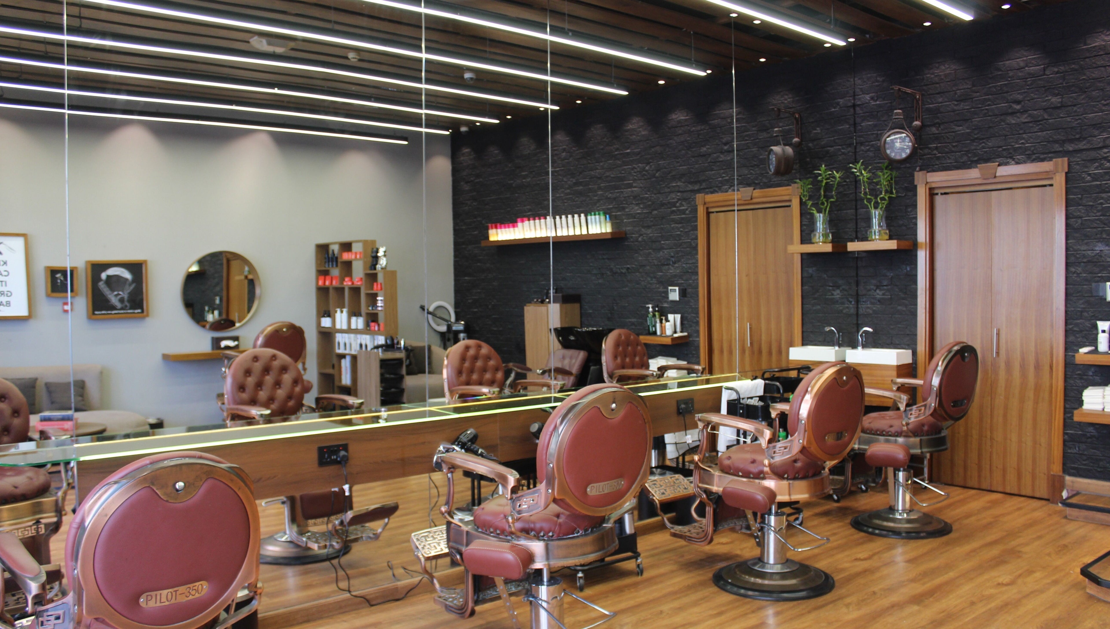 Interior view of Silvio Gents Salon in دبي, دبي, AE, featuring vintage barber chairs and modern decor.
