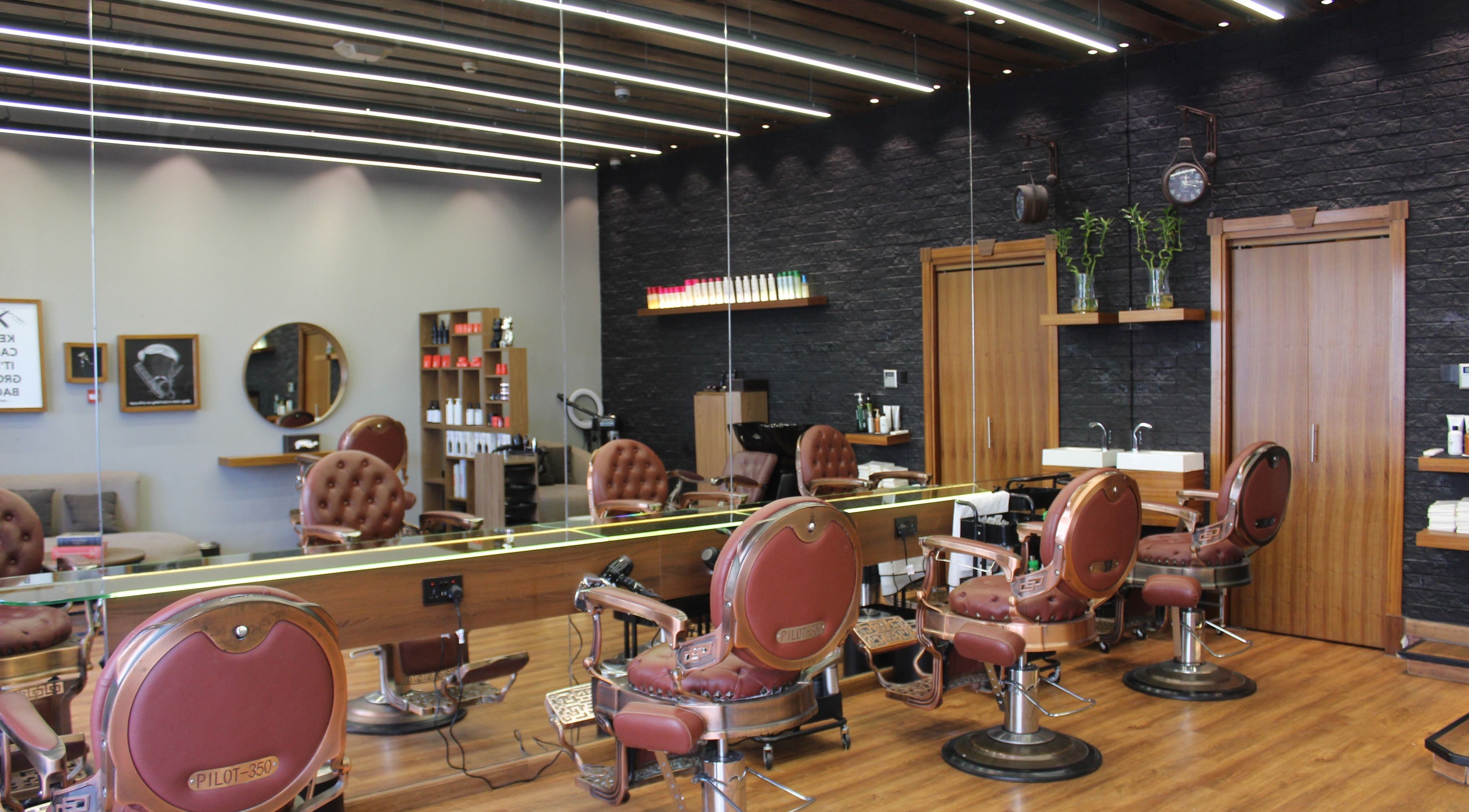 Interior view of Silvio Gents Salon in دبي, دبي, AE, featuring vintage barber chairs and modern decor.