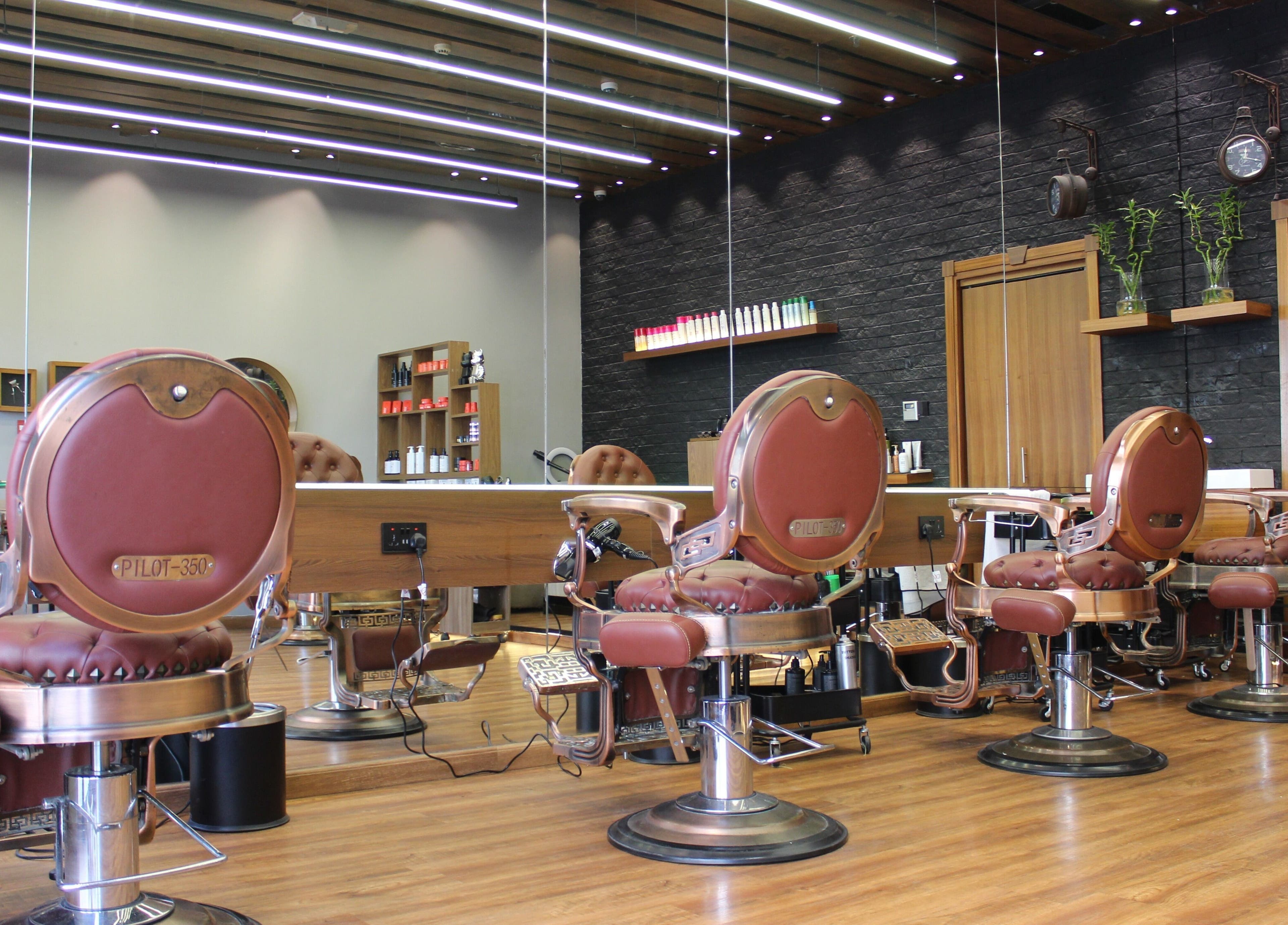 Elegant interior of Silvio Gents Salon in Dubai, Dubai, AE, featuring stylish barber chairs and chic decor.