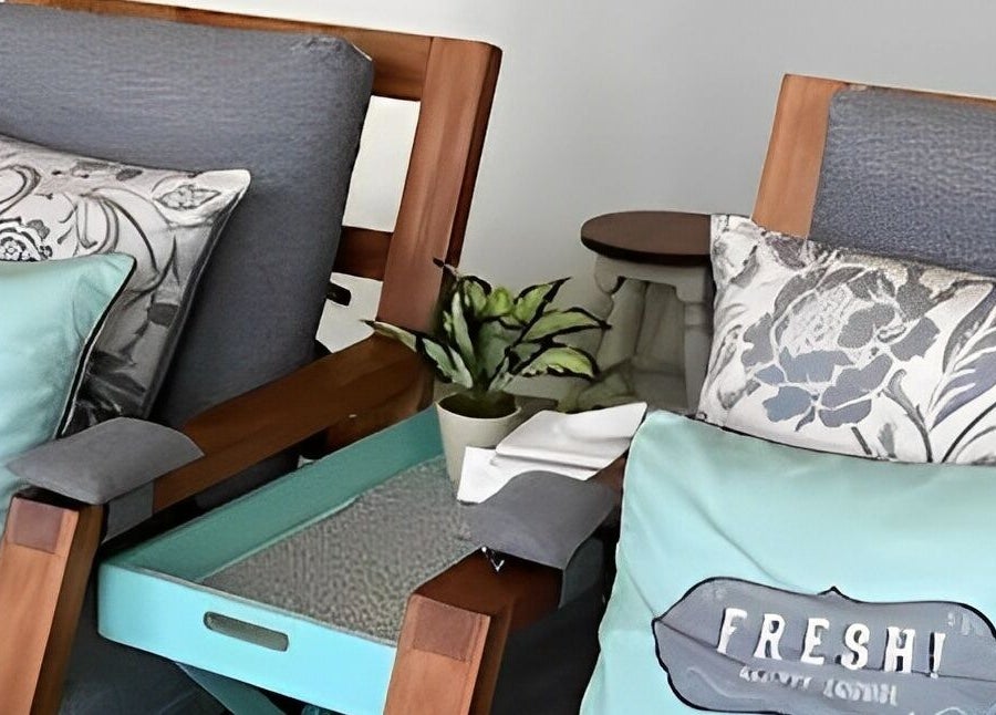 Relaxing seating area at FRESH! Beauty Lounge Uluwatu, Bali, Bali, ID with elegant pillows and decor.