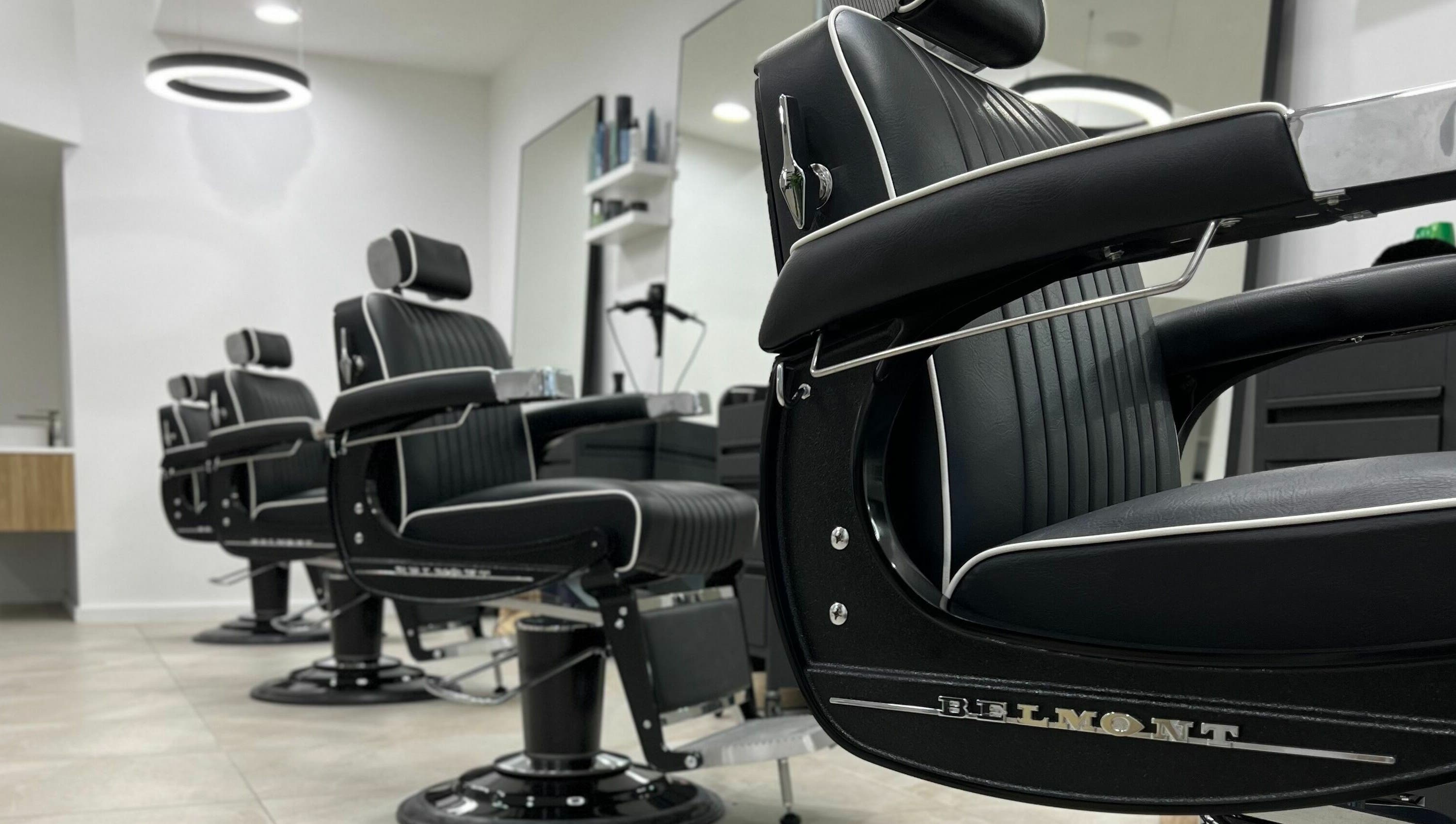 Elegant black barber chairs at AC FLO, Bondi Beach, New South Wales, AU, offering a luxurious grooming experience.