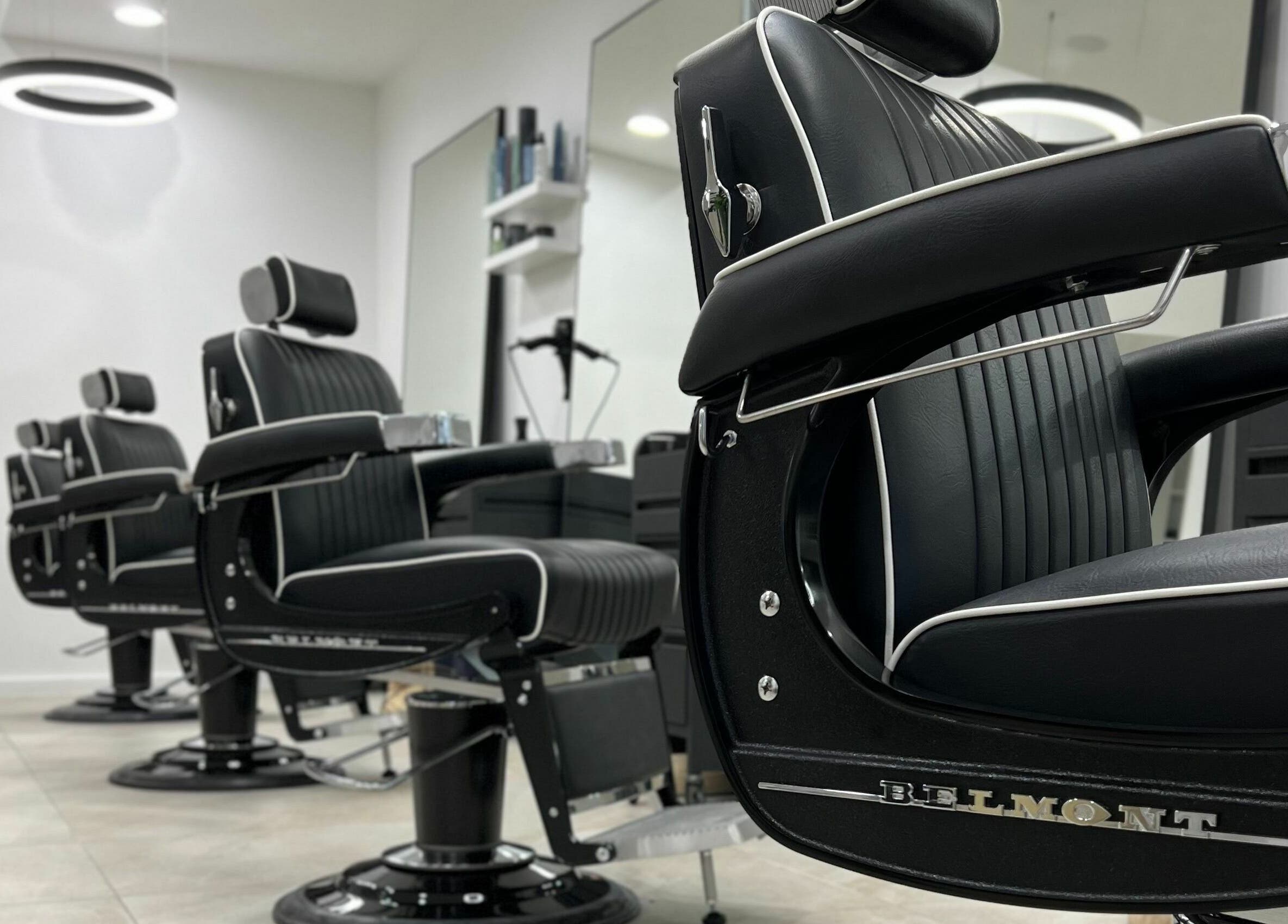 Elegant black barber chairs at AC FLO, Bondi Beach, New South Wales, AU, offering a luxurious grooming experience.