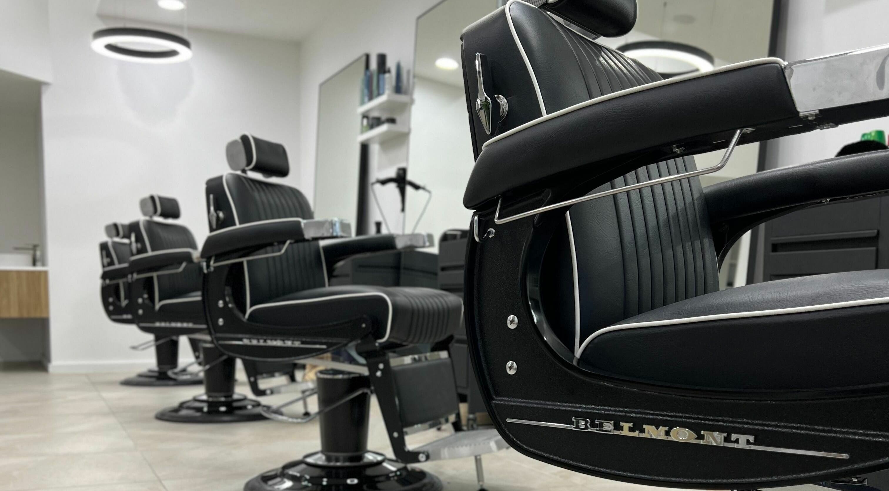 Elegant black barber chairs at AC FLO, Bondi Beach, New South Wales, AU, offering a luxurious grooming experience.
