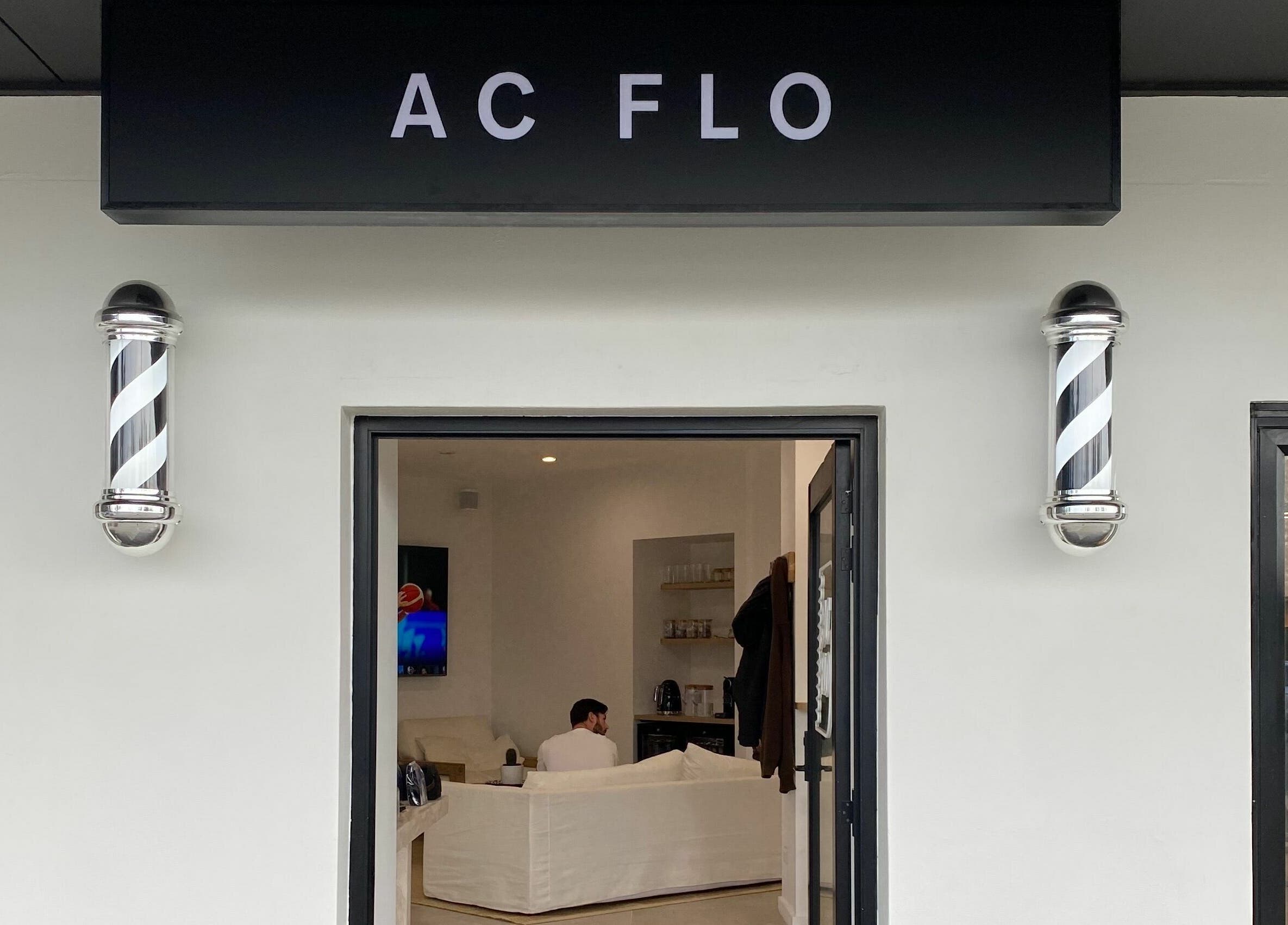 Entrance of AC FLO at Bondi Beach, New South Wales, AU showing a sleek black sign and welcoming lounge.