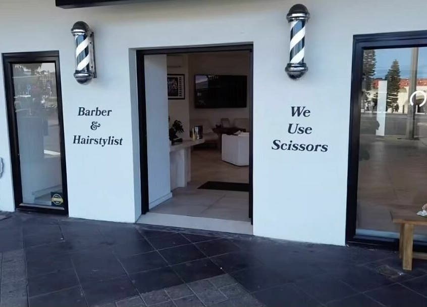 Entrance to AC FLO barber and hairstylist at Bondi Beach, New South Wales, AU.