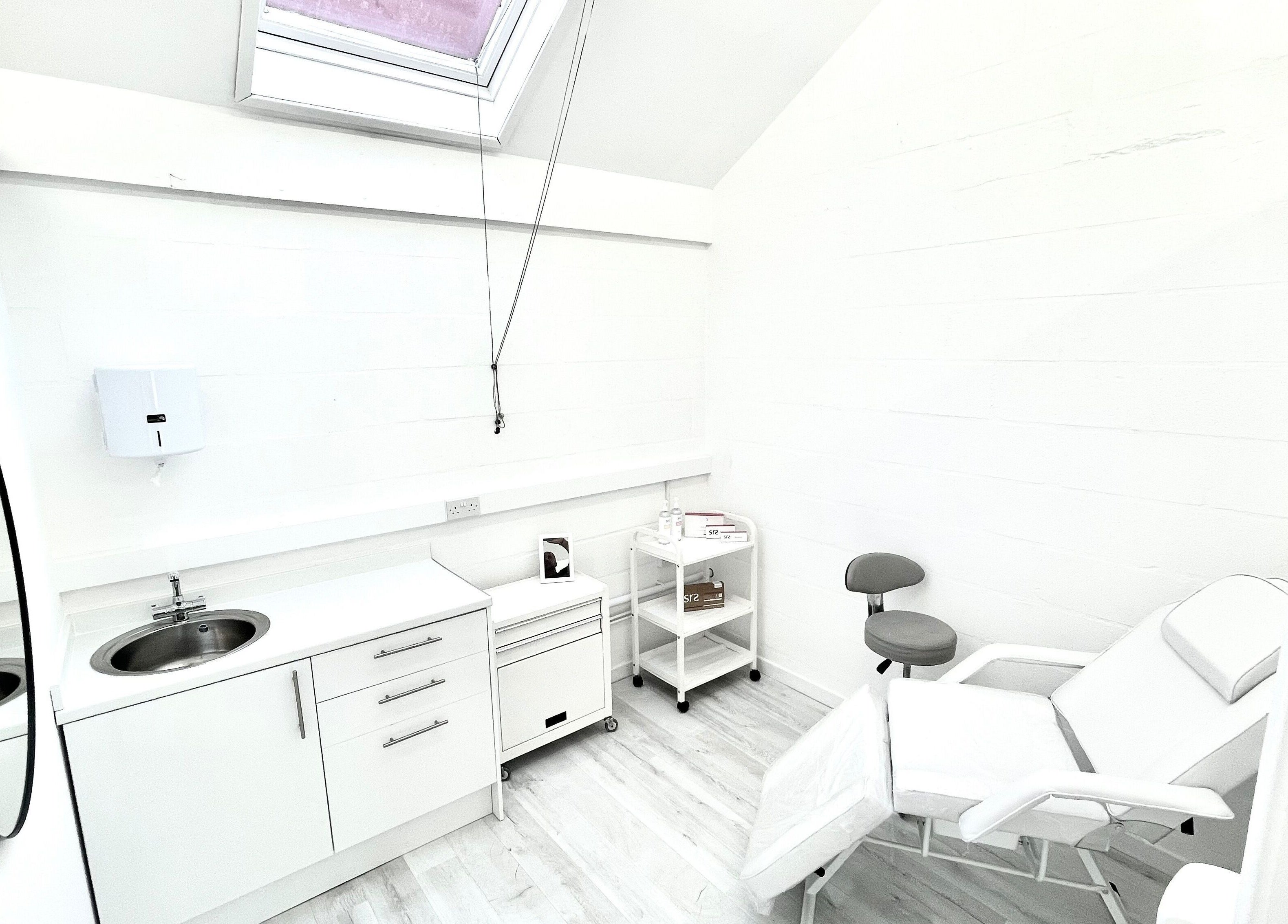 Bright, modern treatment room at Triggs and James Aesthetics, Swansea, Wales, GB. Ideal for beauty services.