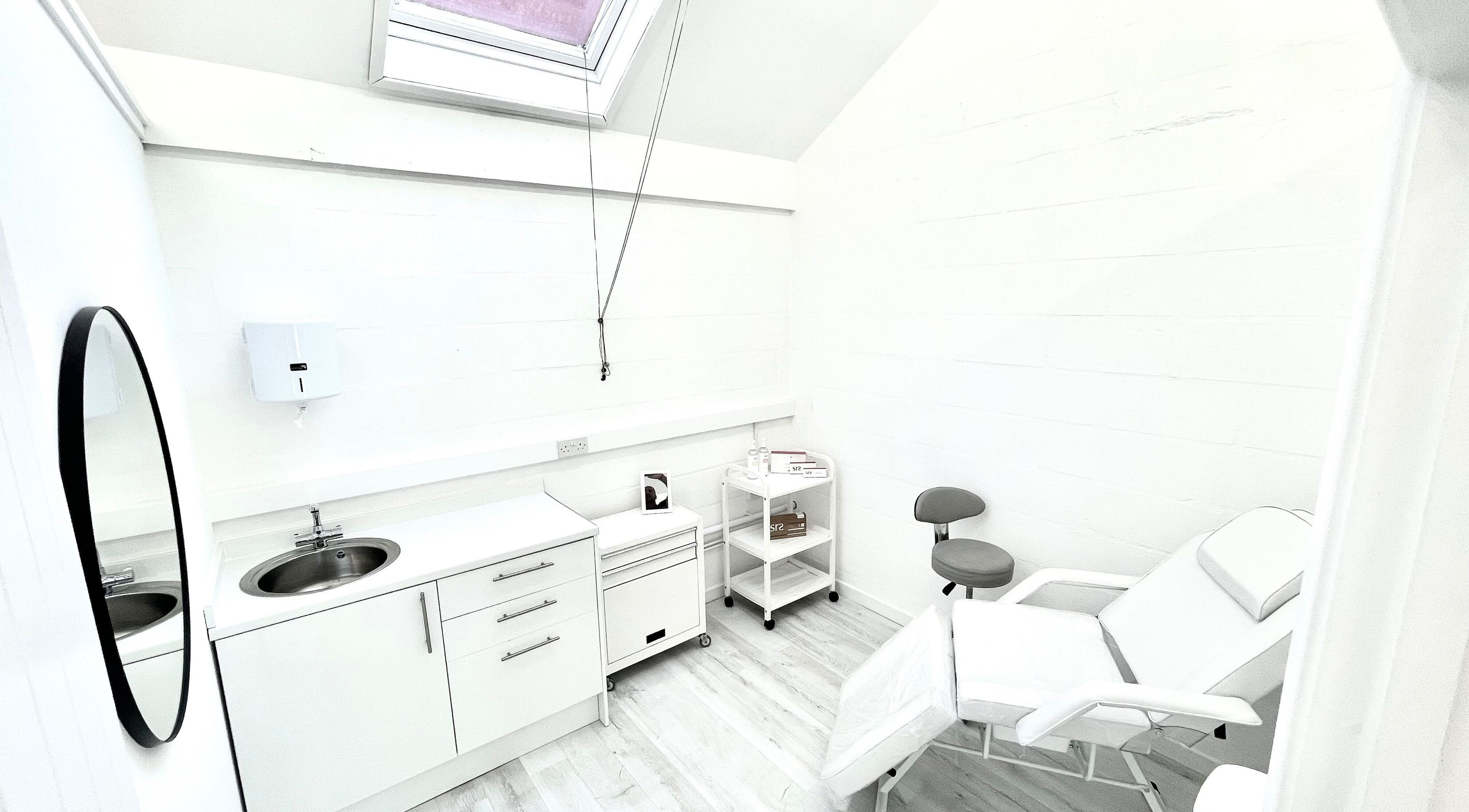 Bright, modern treatment room at Triggs and James Aesthetics, Swansea, Wales, GB. Ideal for beauty services.