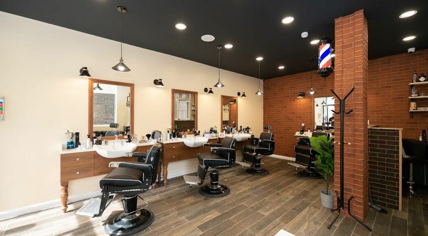 Spacious interior of Head Office Mens' Grooming - Holborn in London, England, GB with modern barber chairs.