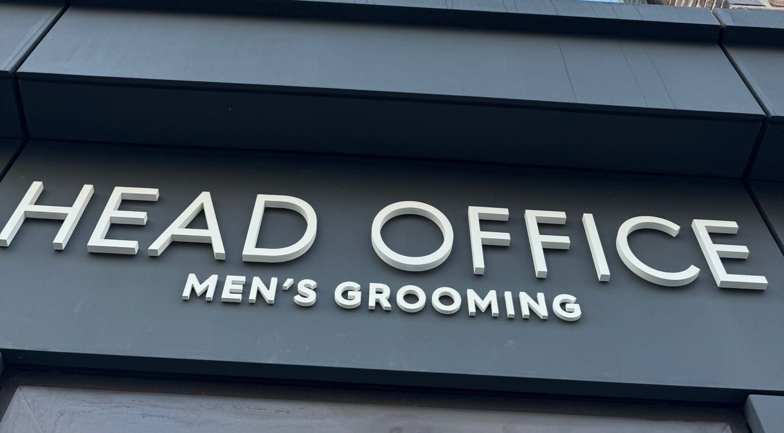 Entrance sign of Head Office Men's Grooming - Waterloo in London, England, GB.