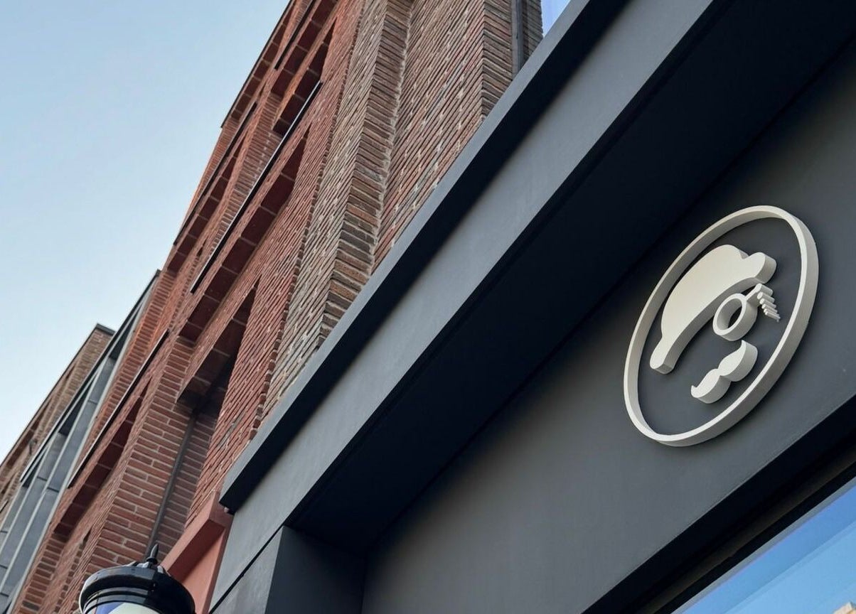 Head Office Men's Grooming in Waterloo, London, England. Exterior signage on a modern brick building.