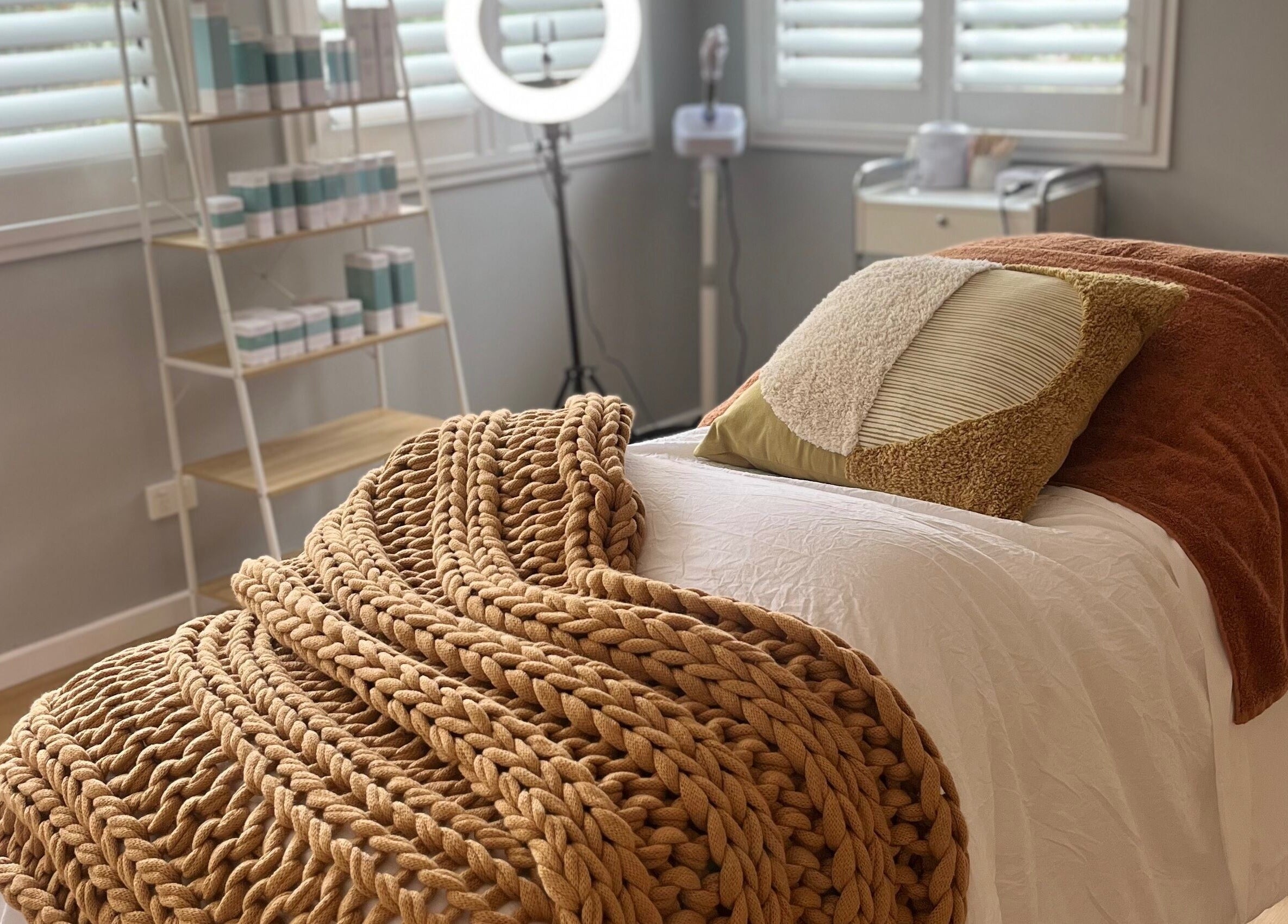Luxurious treatment room at Skin Solace, Blackwood, Victoria, AU, featuring warm tones and soft textures.