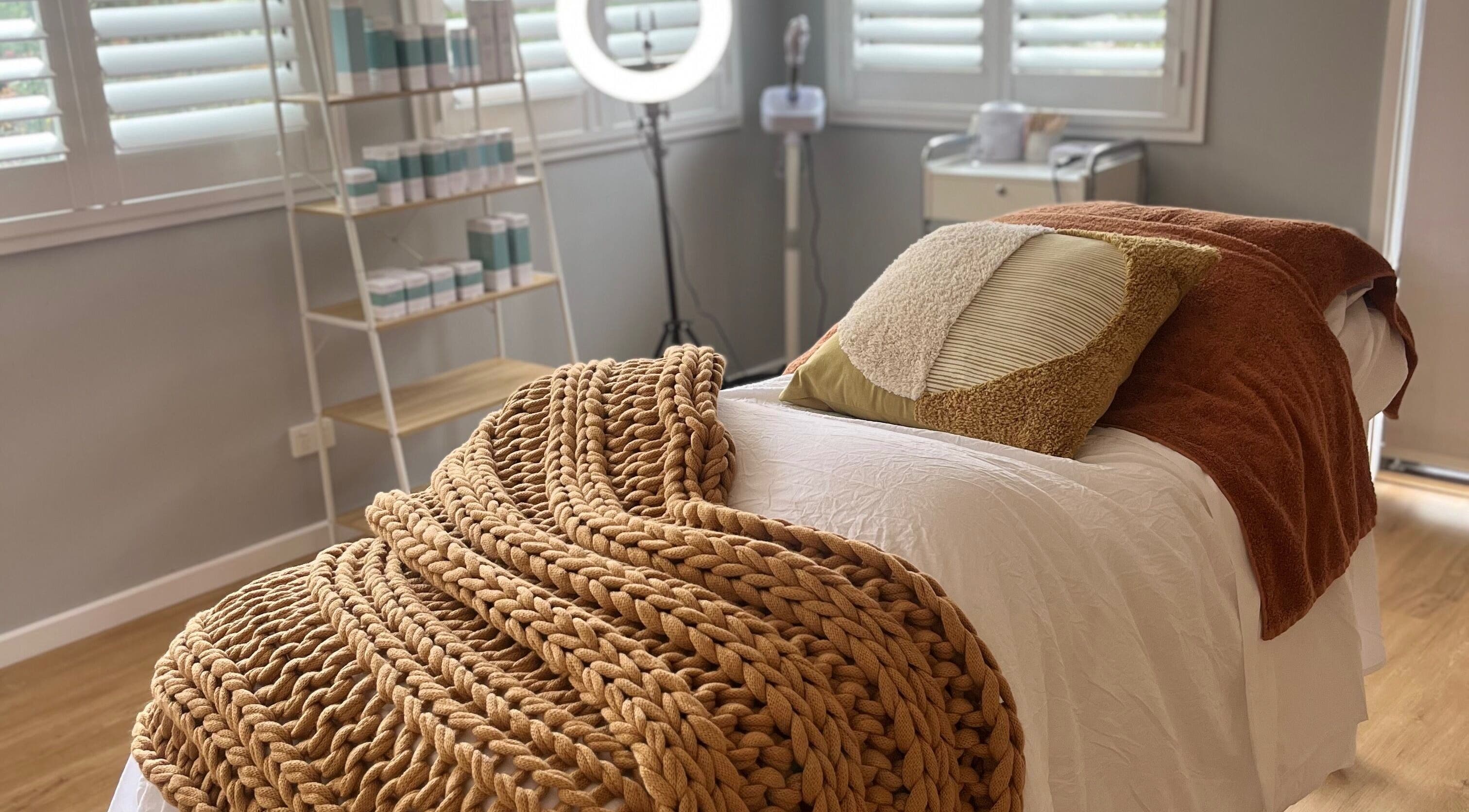 Luxurious treatment room at Skin Solace, Blackwood, Victoria, AU, featuring warm tones and soft textures.