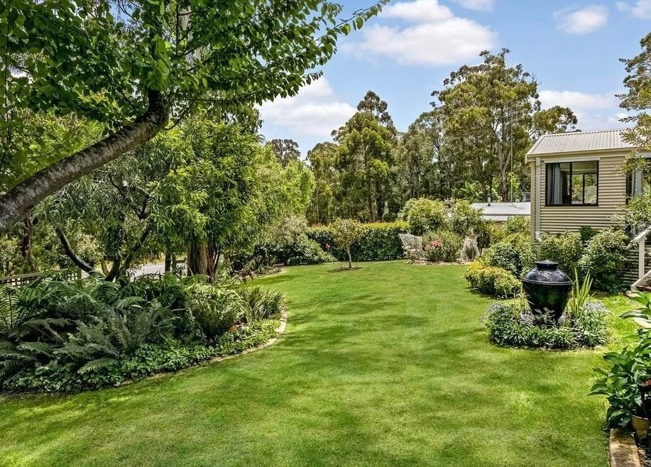 Lush garden view at Skin Solace, Blackwood, Victoria, AU, offering tranquility and natural beauty.