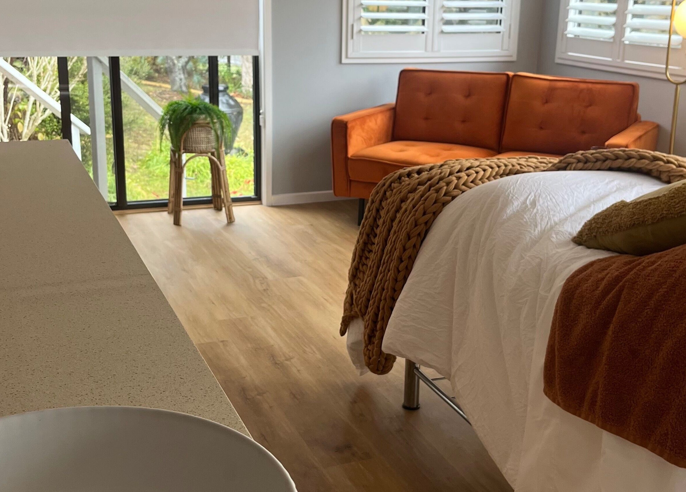 A serene treatment room at Skin Solace, Blackwood, Victoria, AU with a cozy bed and warm, inviting decor.