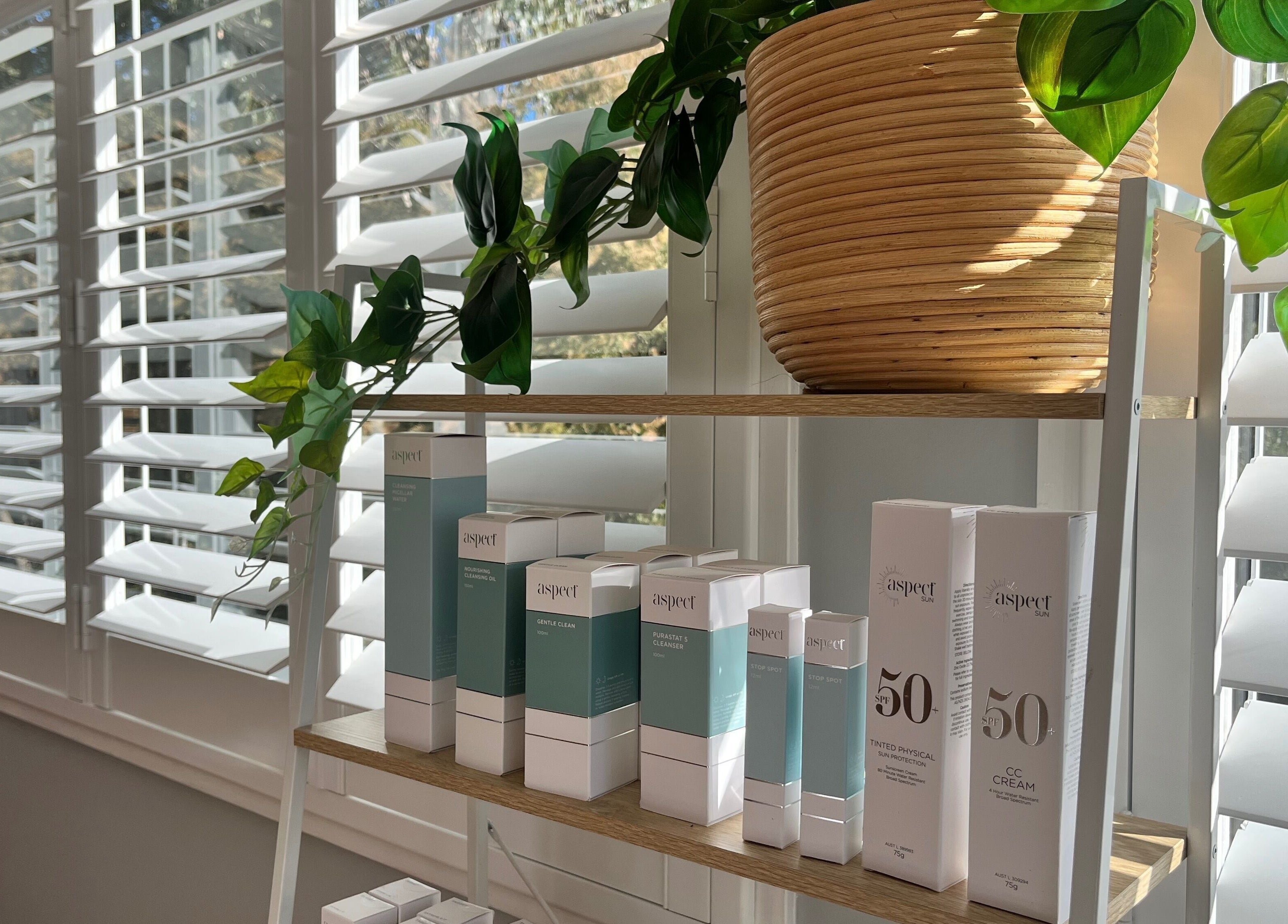 Elegant display of skincare products at Skin Solace, Blackwood, Victoria, AU, with natural light and greenery.