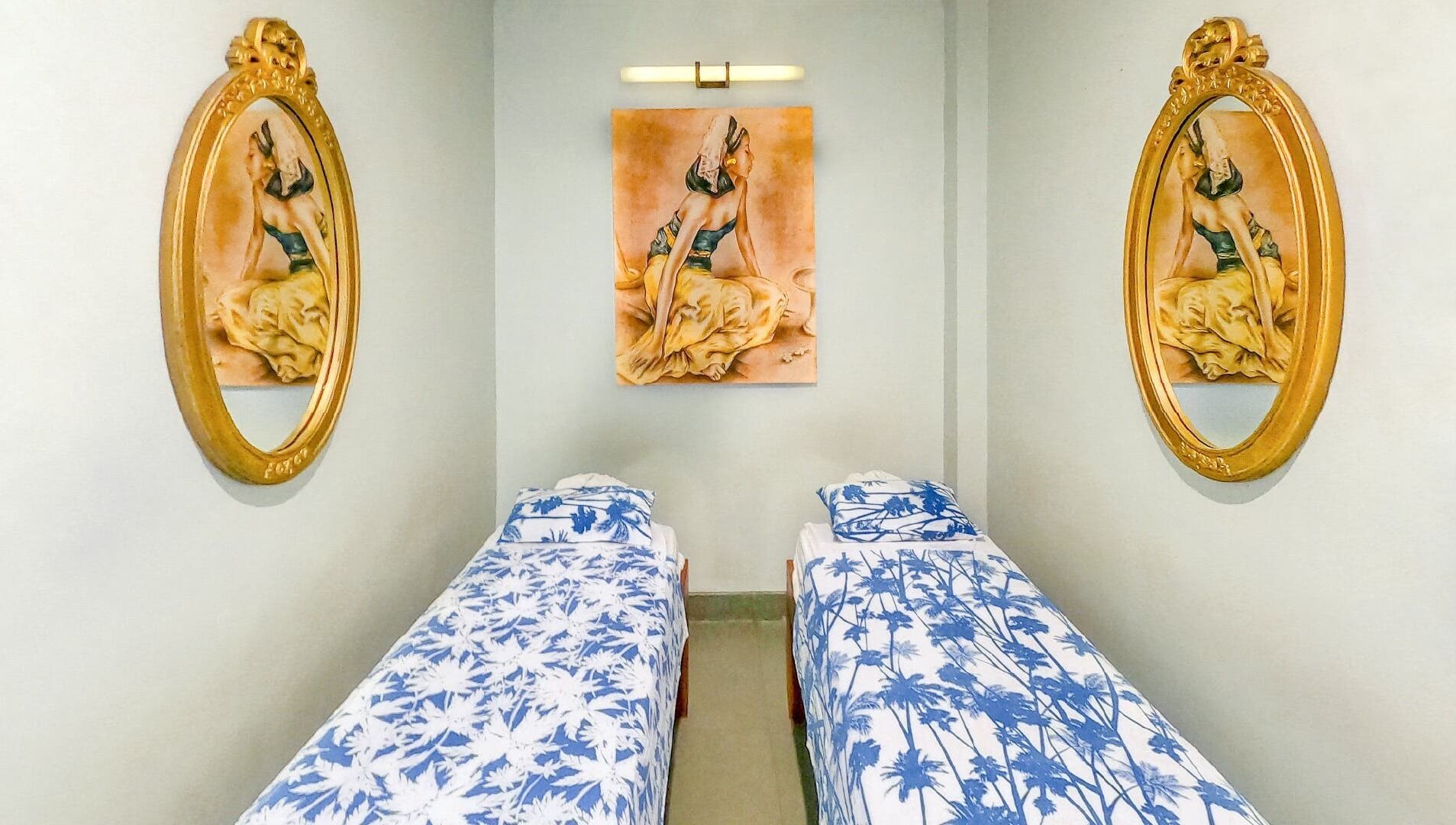 Elegant twin spa beds with artistic decor at Peni Weni, Bali, Bali, ID, creating a calming atmosphere.