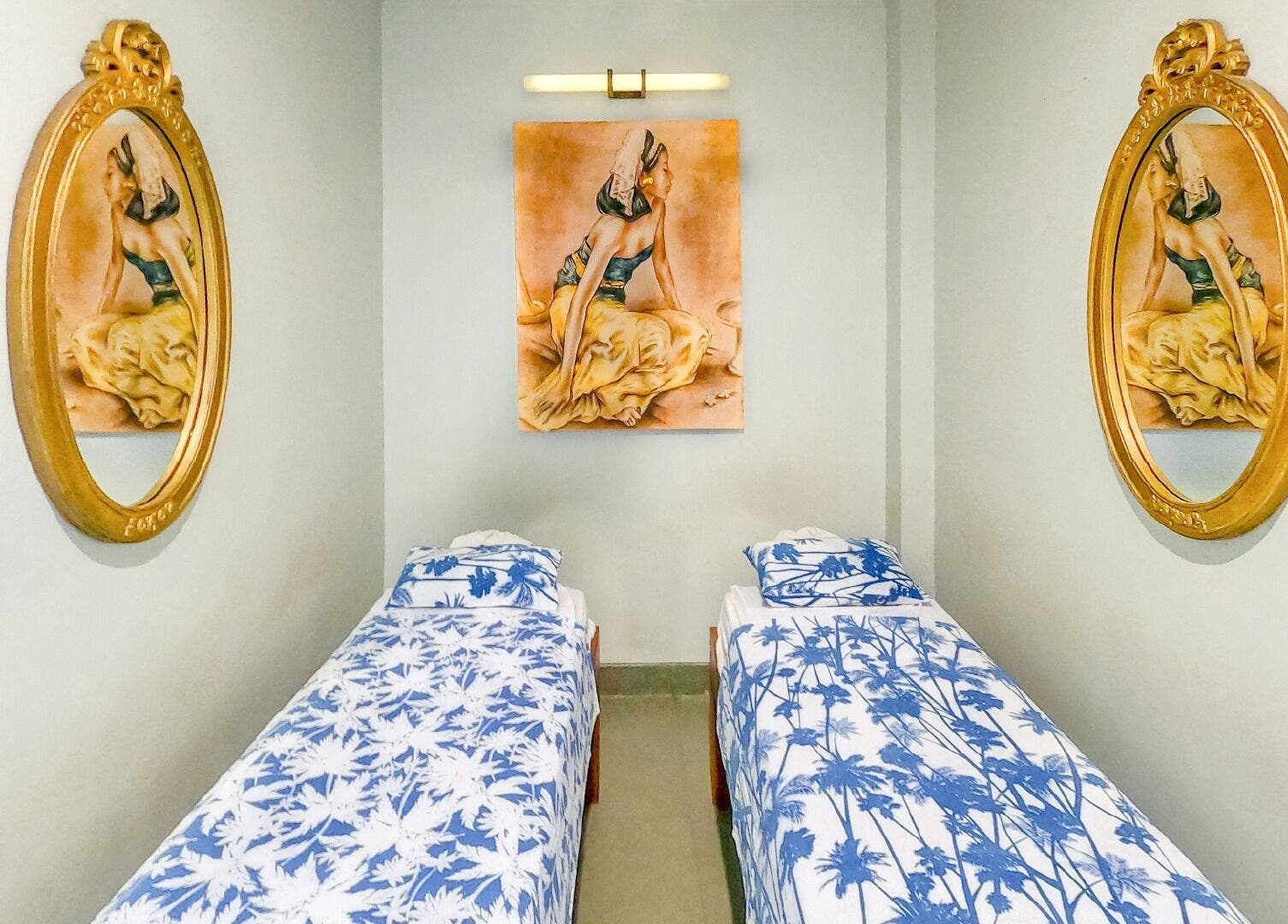 Elegant twin spa beds with artistic decor at Peni Weni, Bali, Bali, ID, creating a calming atmosphere.