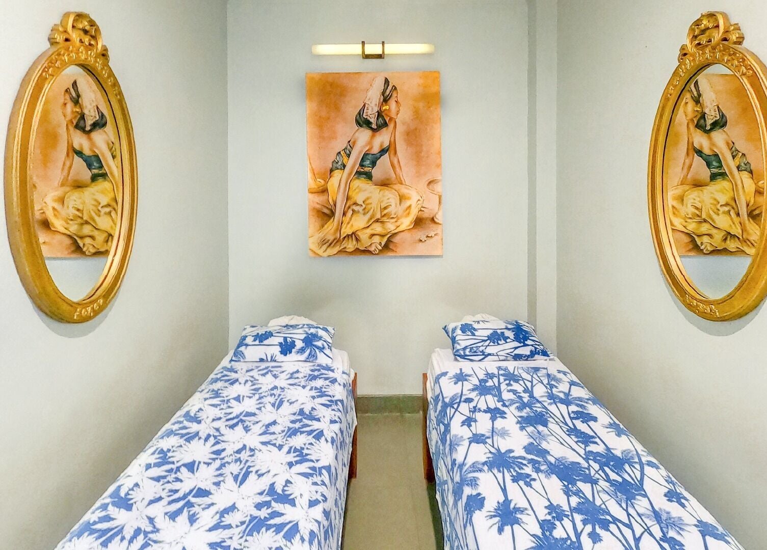 Elegant twin spa beds with artistic decor at Peni Weni, Bali, Bali, ID, creating a calming atmosphere.