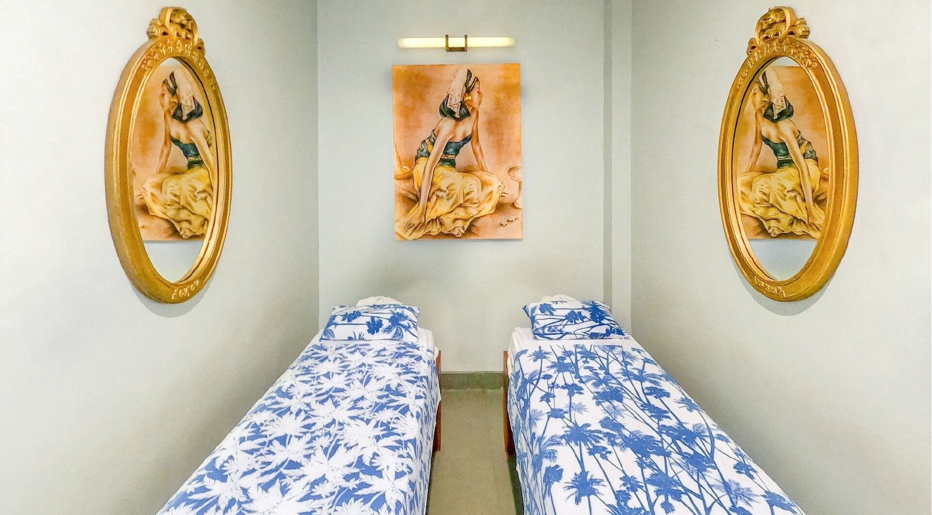 Elegant twin spa beds with artistic decor at Peni Weni, Bali, Bali, ID, creating a calming atmosphere.