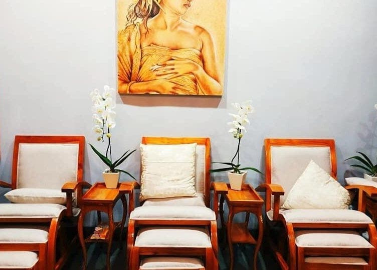 Cozy seating area in Peni Weni, Bali, Bali, ID with elegant wooden chairs and lush orchids.