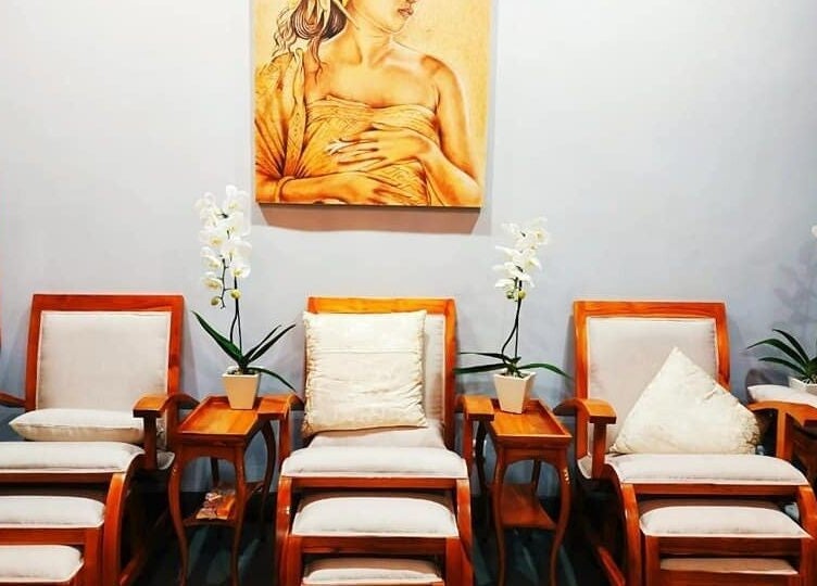 Cozy seating area in Peni Weni, Bali, Bali, ID with elegant wooden chairs and lush orchids.