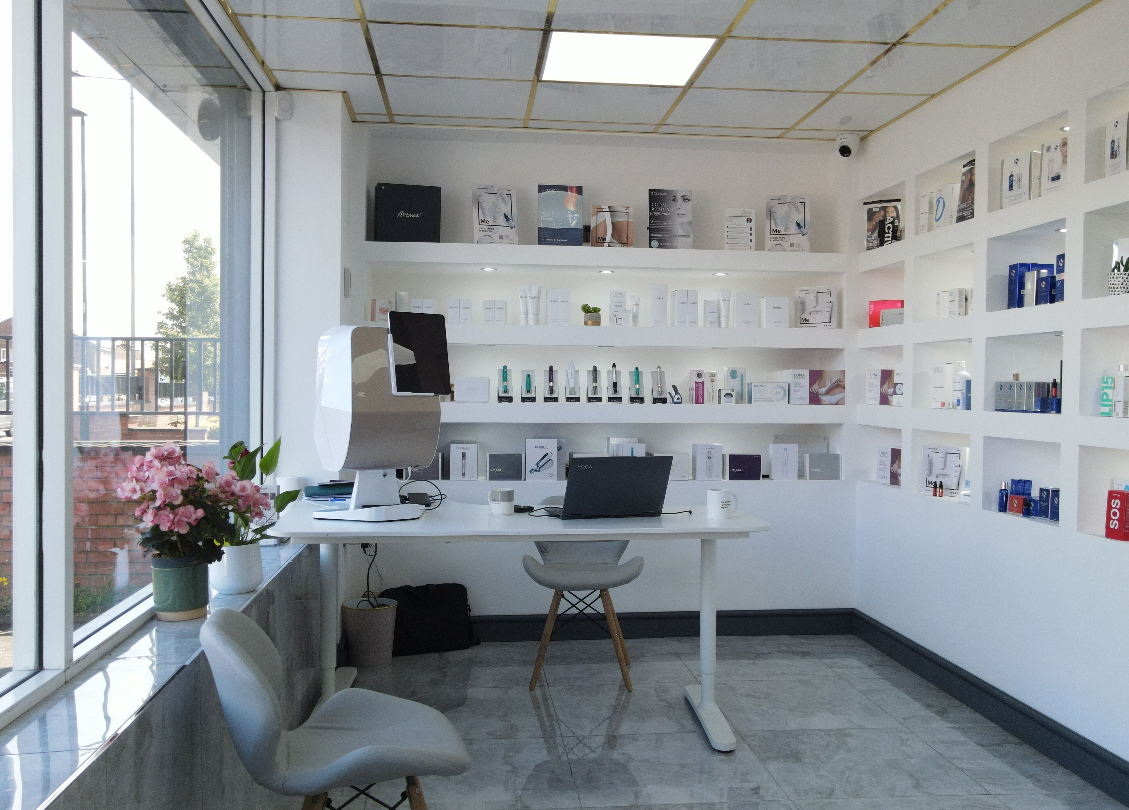Dermacy Clinic in Doncaster, England, GB features a bright, modern interior with a variety of wellness products on display.