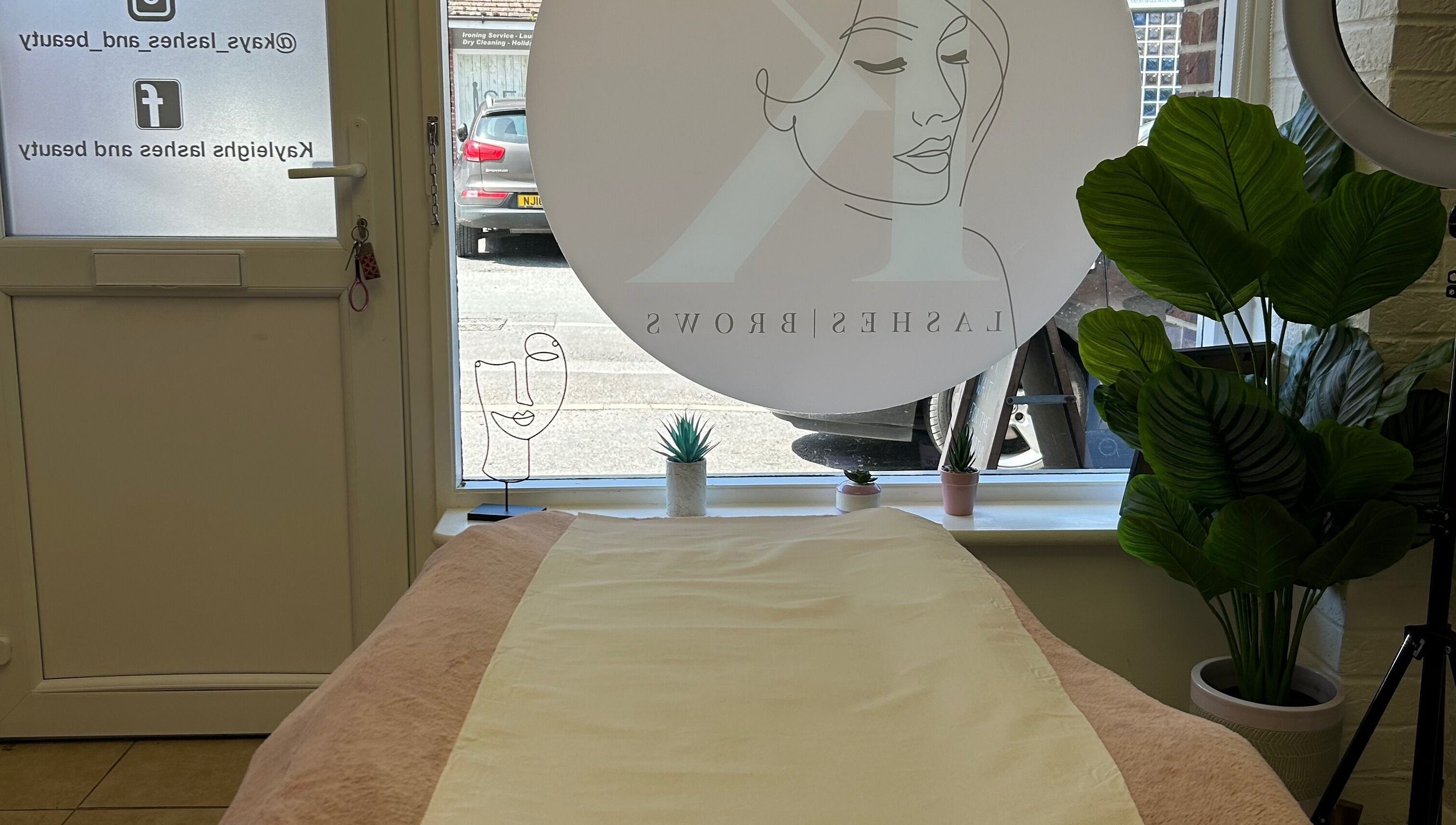Cozy treatment room at Skin Perfected East Wittering, East Wittering, England, GB with elegant decor.