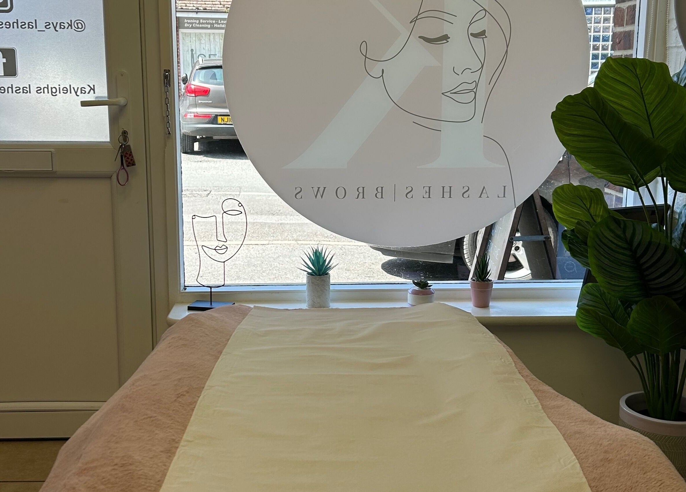 Cozy treatment room at Skin Perfected East Wittering, East Wittering, England, GB with elegant decor.